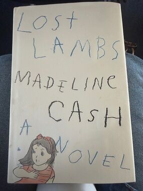 Lost Lambs by Madeline Cash - Cream Hardcover with Blue & Black Lettering